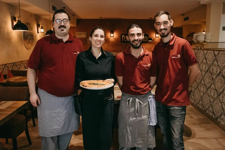 Team der Osteria Antico Il Mattone im Restaurant in Bonn